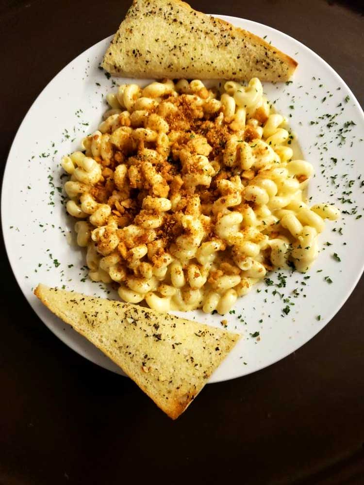 Adult mac and cheese served with warm garlic bread at Cheers Grille & Bar in Concord NH.