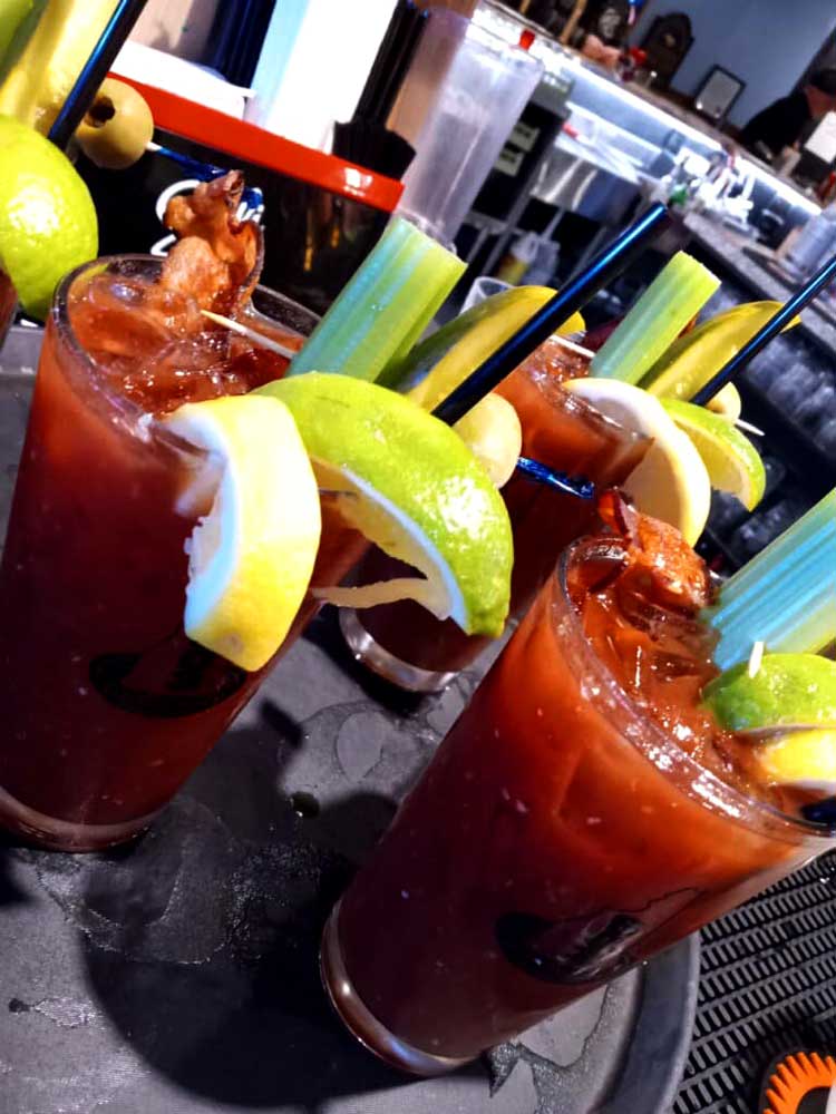 Delicious bloody marys served with bacon, lime celery and more at Cheers Grille & Bar in Concord NH.