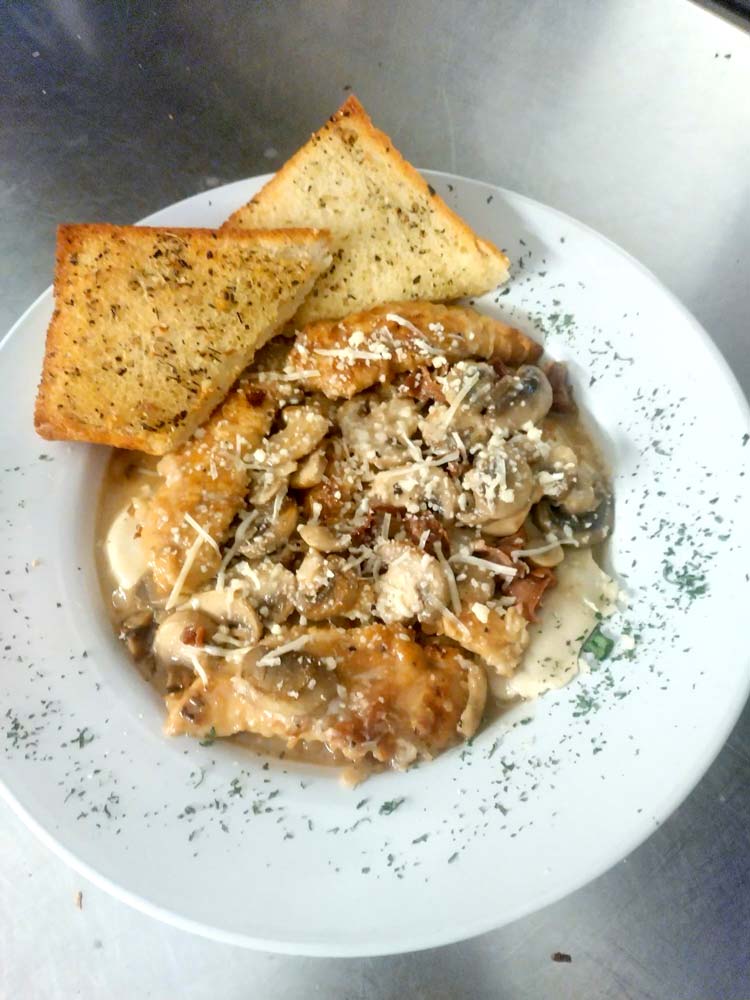 Warm and delicious chicken marsala with garlic toast at Cheers Grille & Bar in Concord NH.
