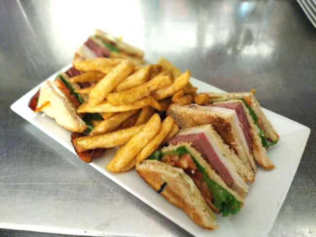 Delicious depot club served with fries at Cheers in Concord.