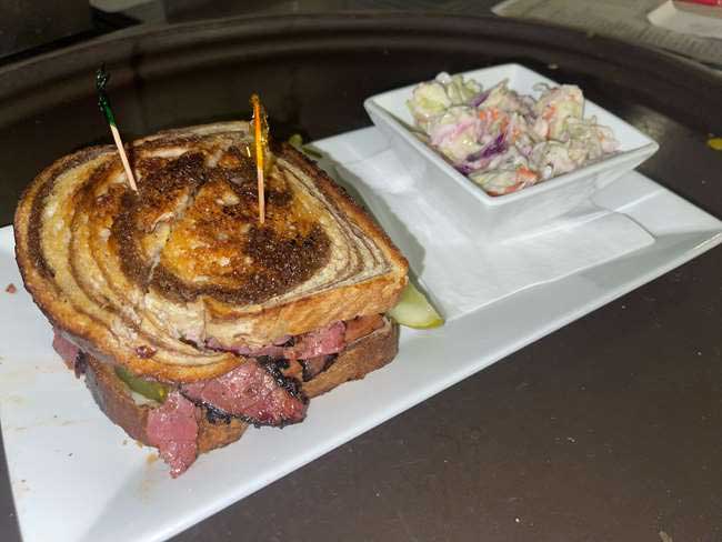 Delicious pastrami sandwich served with coleslaw at Cheers Grille & Bar in Concord NH.