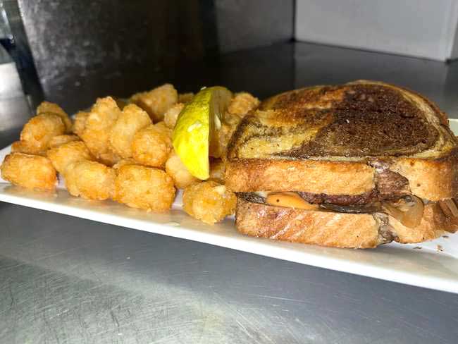 Enjoy a hot and delicious patty melt, serve with cheese curds at Cheers Grille & Bar in Concord NH.