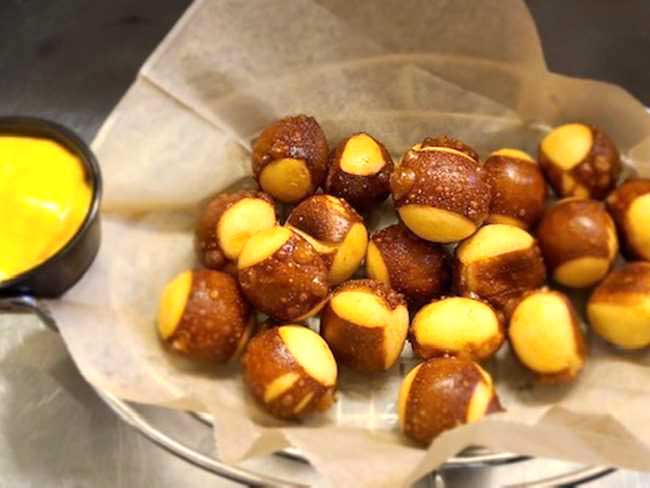 Come to Cheers in Concord NH and enjoy hot warm and soft pretzel bites with cheese dip.