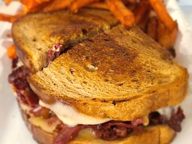 Bacon melt served with sweet potato fries at Cheers Grille & Bar in Concord NH.