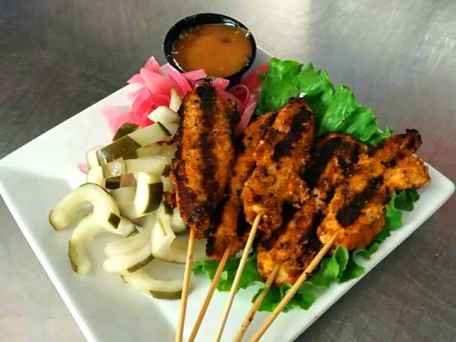 Enjoy delicious Thai chicken skewers served with dipping sauce at Cheers Grille & Bar in Concord NH.